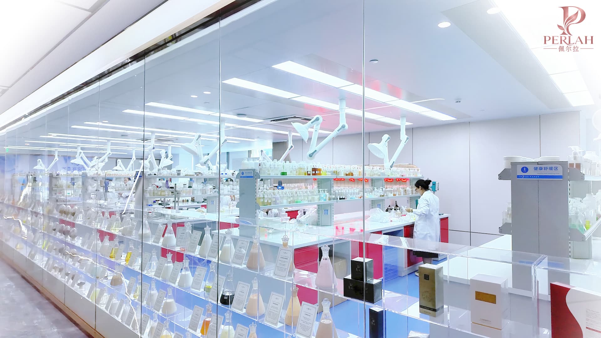 PERLAH research laboratory with formulation samples and a technician at work